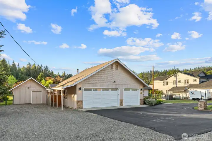 Bring your toys, tools, and projects. This double lot features an attached three-car garage plus a spacious detached shop.
