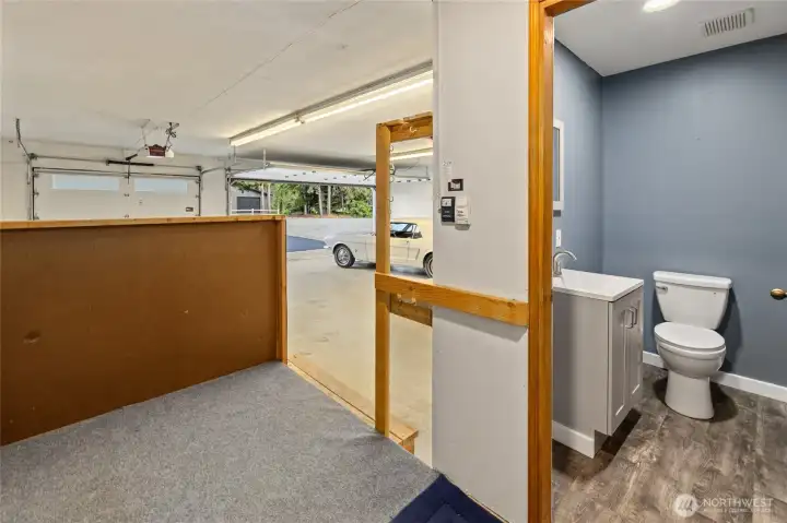 Complete with a convenient half bath, the attached three-car garage is designed for both storage and practicality.
