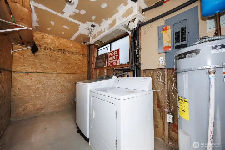 Laundry room downstairs next to the garage Laundry room downstairs next to the garage