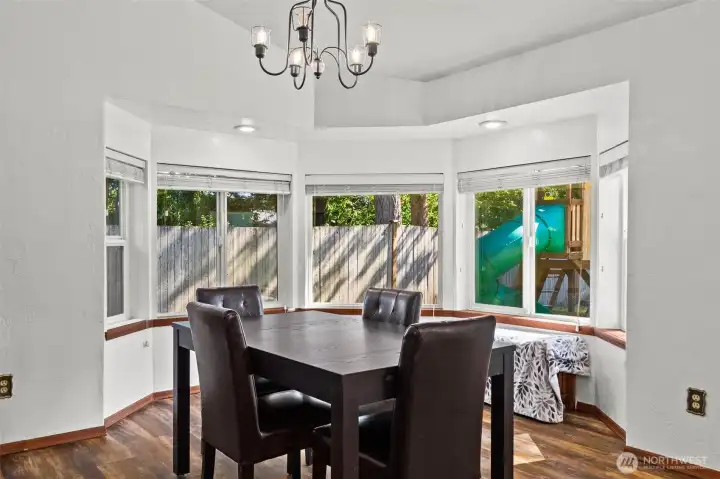 Charming dining area with bay windows to bring in the light. Charming dining area with bay windows to bring in the light.