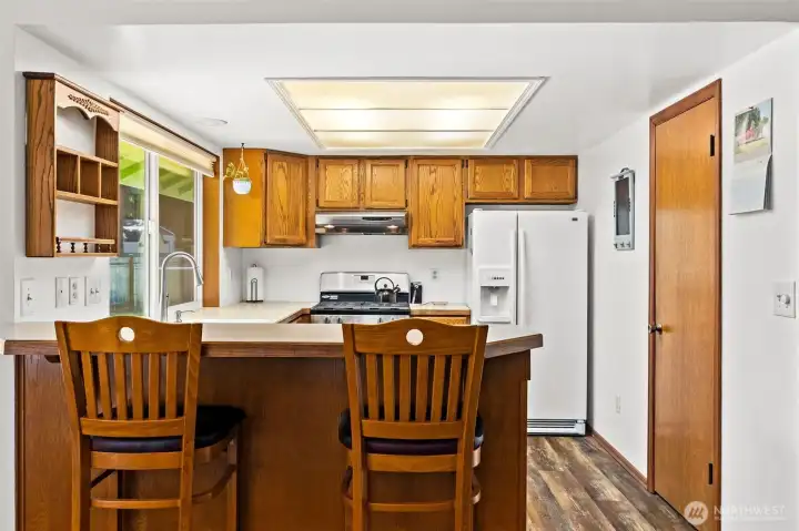 Open kitchen with pull-up seating. Open kitchen with pull-up seating.