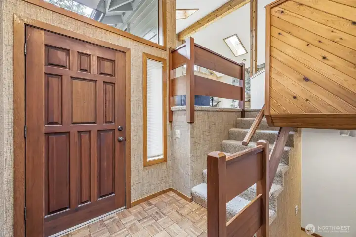Entry is light and bright. This home has tons of windows, wood accents and open floor plan. Entry is light and bright. This home has tons of windows, wood accents and open floor plan.