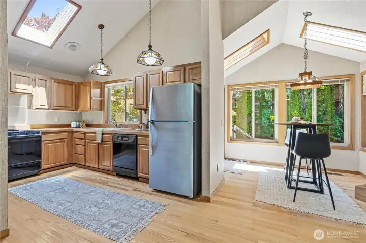 Vaulted ceilings carry through all main living areas with skylights to brighten home any time of year. Kitchen is open to nook. Room to add an island if you desire. Vaulted ceilings carry through all main living areas with skylights to brighten home any time of year. Kitchen is open to nook. Room to add an island if you desire.