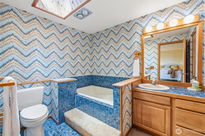 Primary ensuite with deep soaking tub. Primary ensuite with deep soaking tub.