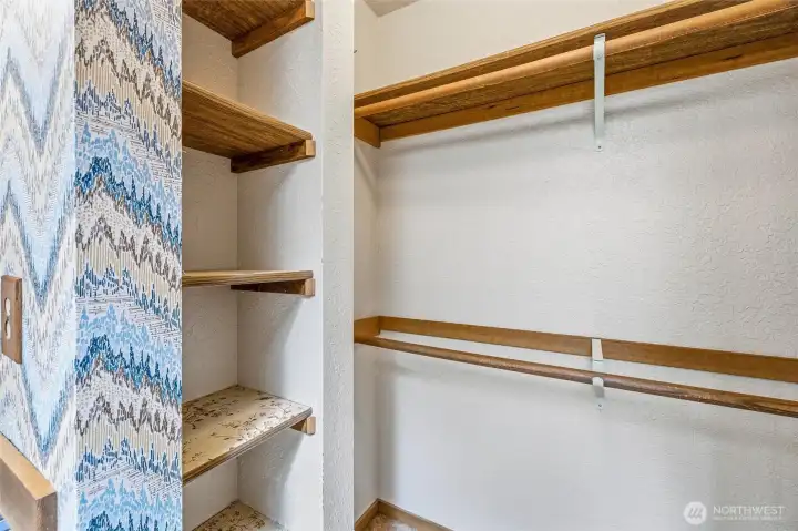 Primary walk-in closet. Primary walk-in closet.