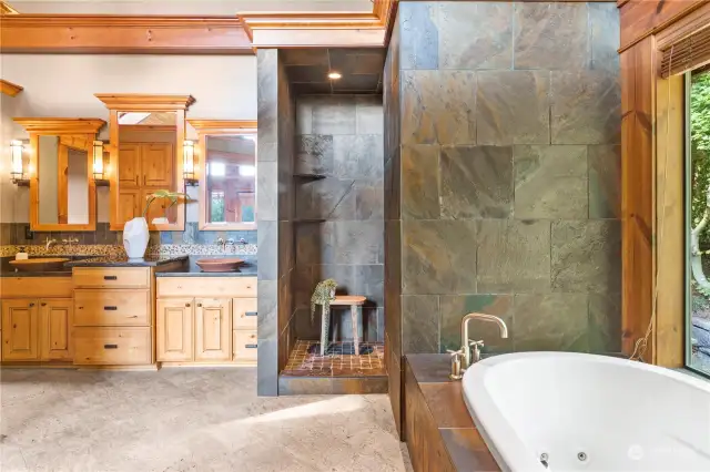 Break away in the spa-inspired bath with heated granite floors, a slate stone walk-in shower with eight heads including body sprays.
