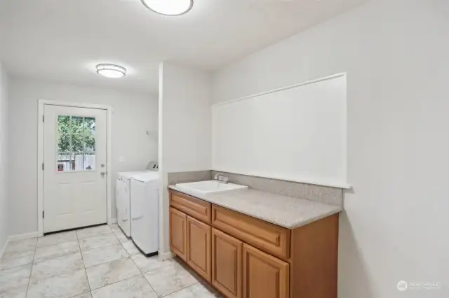 Spacious laundry room in lower level