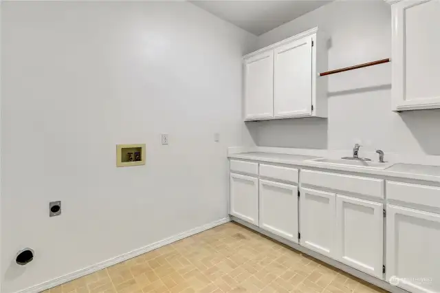 Huge laundry with sink and storage