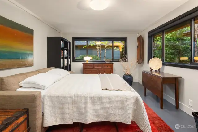 Bedroom on the main floor offers back garden views. Closets are fitted by California Closets.