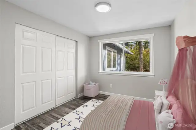 3rd Bedroom with new wood wrapped window and Luxury vinyl plank flooring.