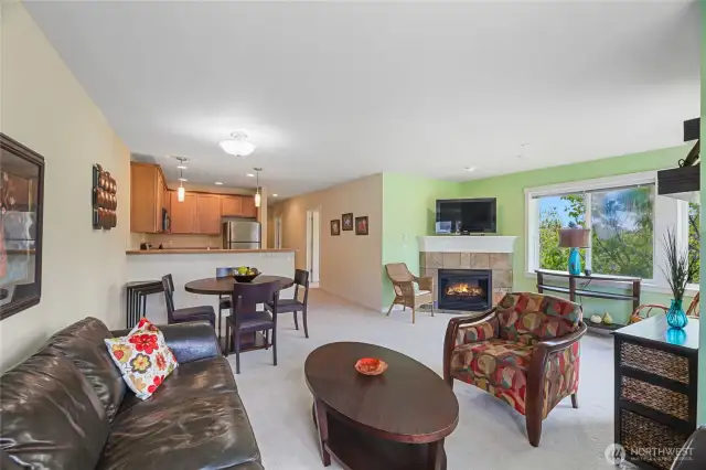 Photo looking from Living Room to the Dining space and Kitchen. Front door is down the hall.