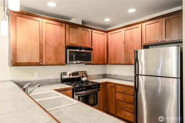 Kitchen is pristine with lightly used SS appliances.