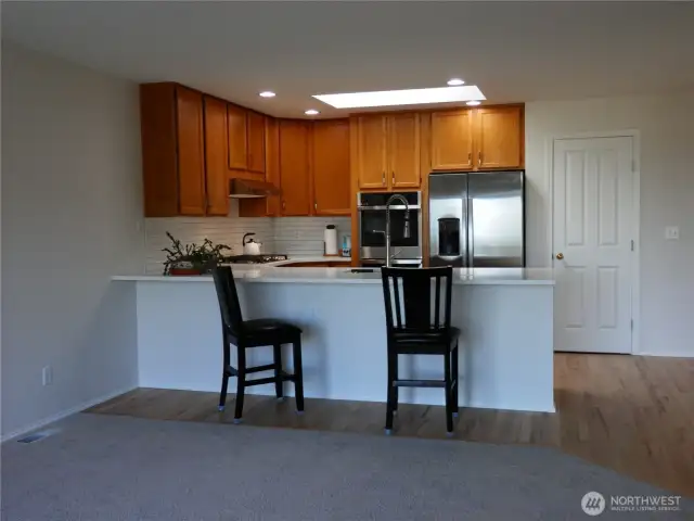 The kitchen integrates with the family room area