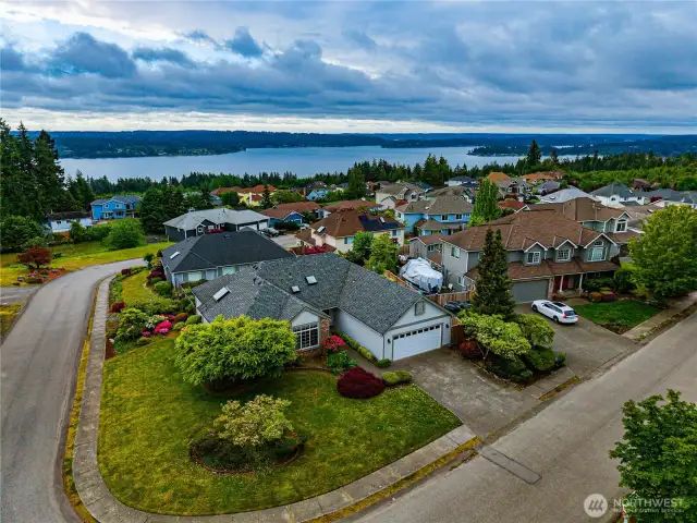 Zooming out a bit, we are looking east SE.  This is a corner lot at the top of the hill and the elevations drop to the east so you have a small water view of Dyes Inlet.