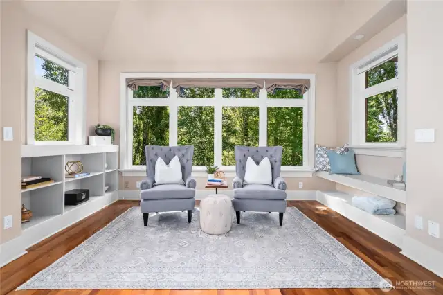 Sunlit Sitting Room Surrounded by Nature - Builtin Bookcases & Hardwood Floors
