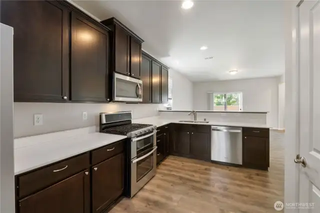 Kitchen with lots of cabinets and stainless steel appliances!