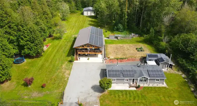 This 5-acre retreat has plenty of room to roam—this aerial view captures the layout, privacy, and potential of this one-of-a-kind property.