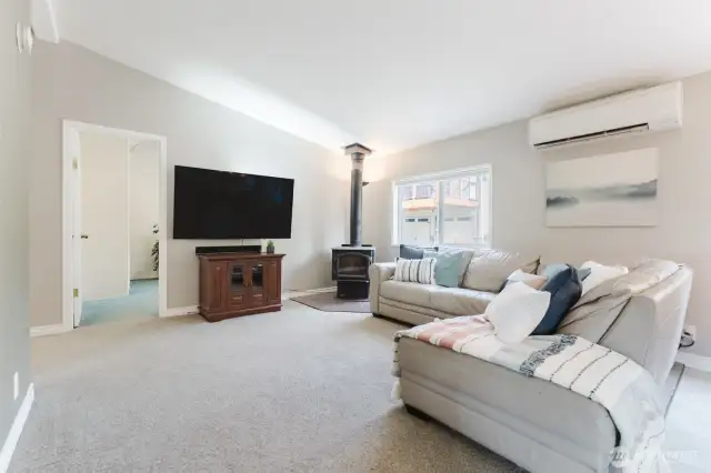 Kick back and get cozy—this relaxed family room with a wood-burning fireplace is made for movie nights, game days, and quiet weekends in.