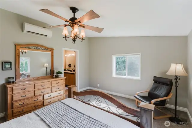 Your own peaceful retreat—this spacious primary bedroom offers a calm place to start and end your day. A walk in closet to the left (not shown) gives ample space to store everything.