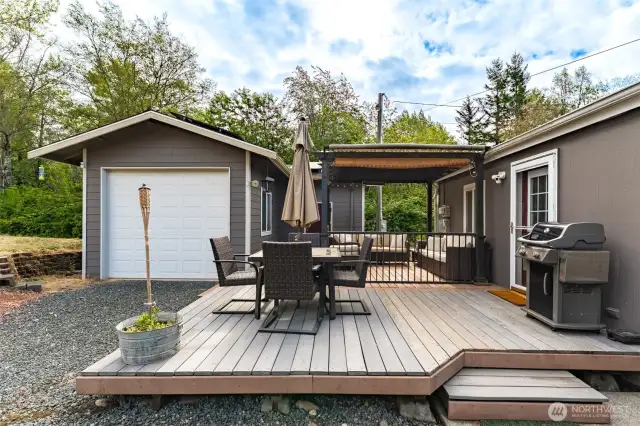 Spacious and tucked between the main house and detached garage, this patio is made for entertaining—BBQs, birthdays, or just a quiet evening under the stars.