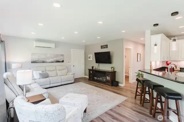 Upstairs, step into the ADU’s cozy living room—an ideal setup for relaxing, hosting, or giving guests their own space to unwind. With a separate entrance from the downstairs, it could easily be rented out on it's own in addition to the downstairs office/man cave space.
