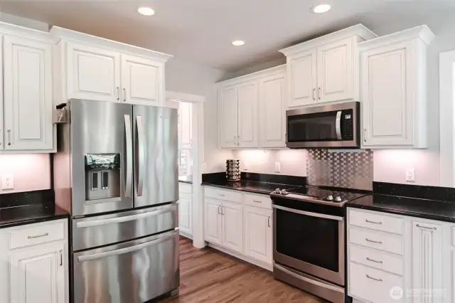 A second look at the ADU kitchen shows off its generous counter space and open layout—plenty of room for everyday living or entertaining.