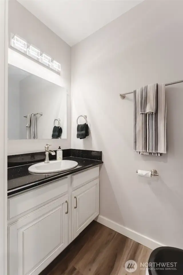 Conveniently located for guests, this half bath adds extra functionality without taking up too much space.