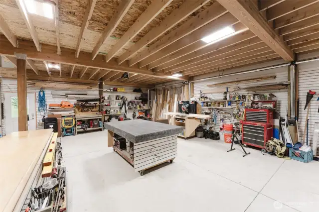 Room to build, fix, or store just about anything—this massive lower-level shop space is ready for your next big project. The built in dust collection system keeps the space clean while the upgraded slat wall panels make organizing a breeze.