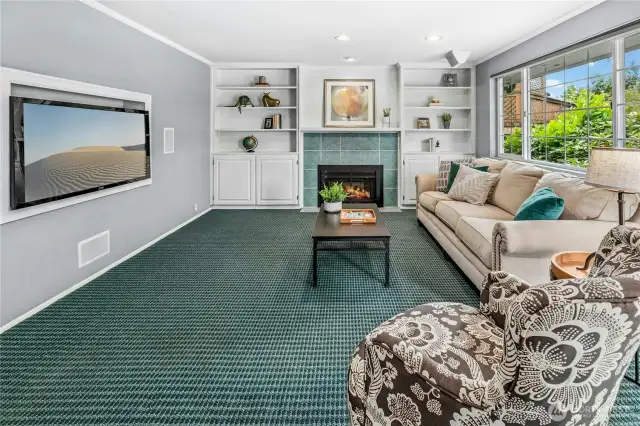 You have a dedicated space for the TV, and a surround-sound system that is wired here and to the wall by the kitchen.