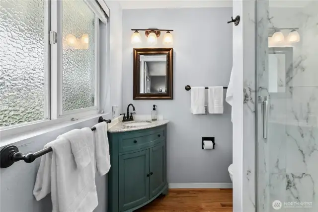 The primary bath is updated and oh so pretty.