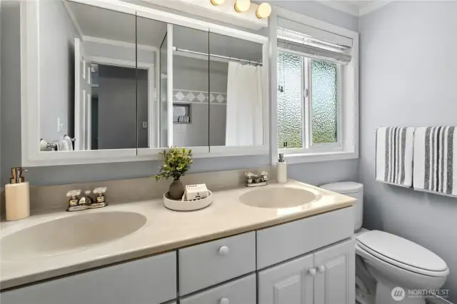 The hall bath has twin sinks for easy sharing.