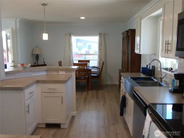 Dining room off kitchen with room for china hutch
