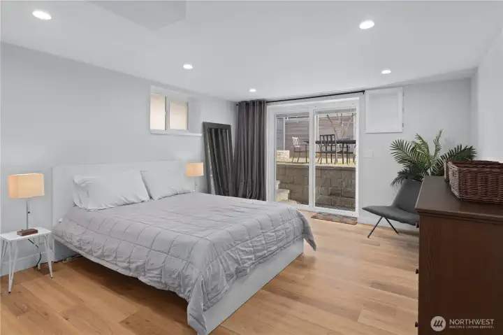Bedroom 4 and entry way to yard on lower level