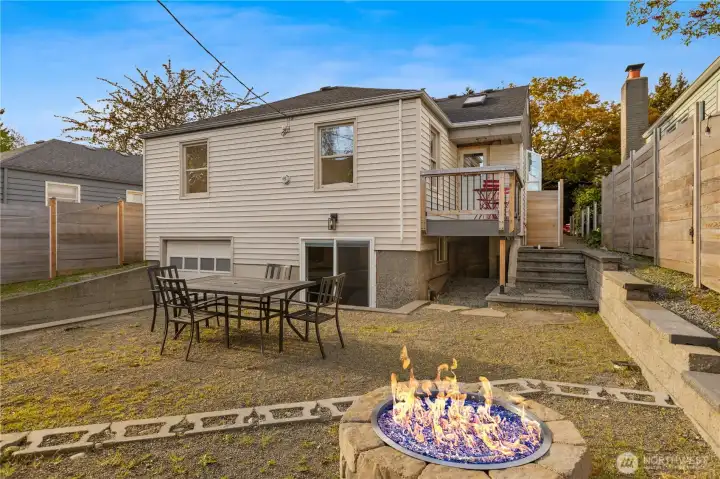 View of home, yard, and patio from the yard