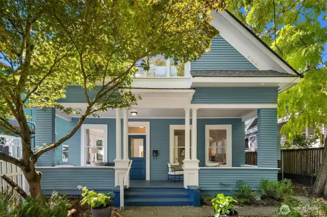 Thoughtfully positioned off the street, this freshly painted home offers a full length, shaded front porch for exceptional outdoor living. Shared driveway to off-street parking to the left/south.