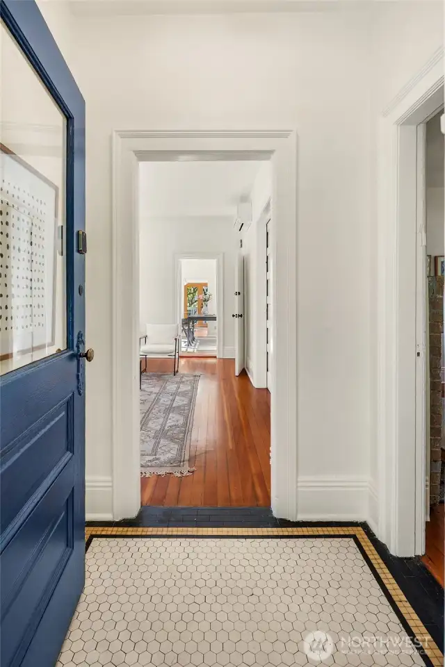 Classic era details throughout. What's not to love about the original front door and period tile entry?