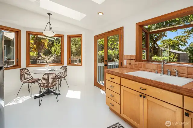 New appliances in the eat in kitchen with French doors leading to the rear garden and raised deck.