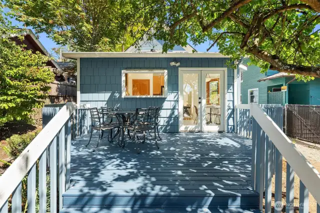 Lovely back deck conveniently located off the kitchen. Al fresco dining with a western view of Downtown Seattle.