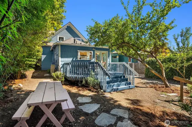 Lovely back deck conveniently located off the kitchen. Al fresco dining with a western view of Downtown Seattle.