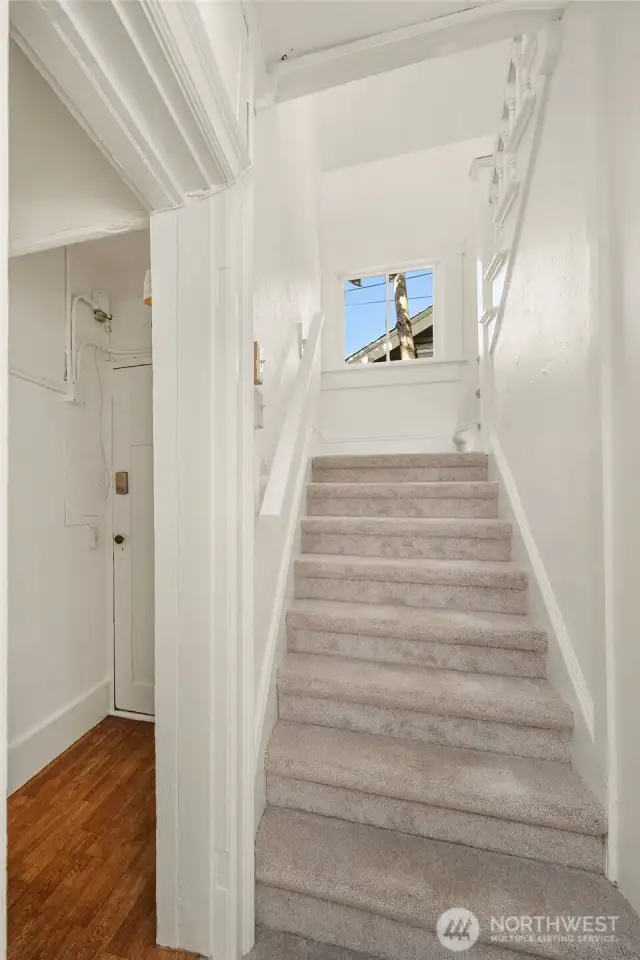 Back inside, these stairs lead to the (2nd) rental area. Stairs are accessible off the living room, or from the side door the the left.