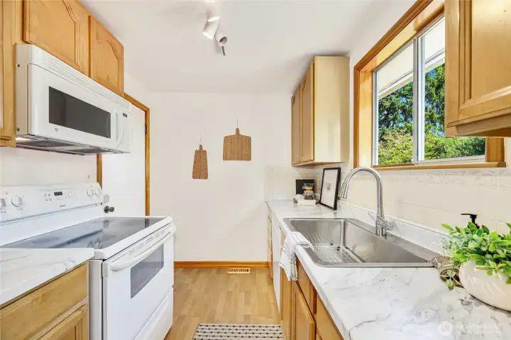 Kitchen, new countertops and SS sink.