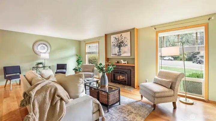 Enter to beautiful hardwoods throughout the main level, that flow into a warm and inviting living room
