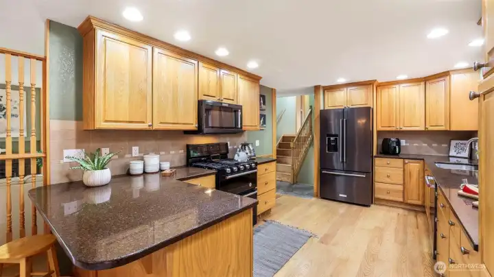 Featuring sleek stainless steel appliances that bring modern convenience to the heart of the home.