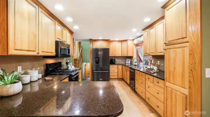 Abundant cabinet storage and expansive countertops make this kitchen as functional as it is beautiful.