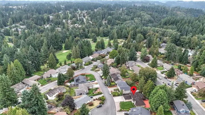 Nestled in a quiet cul-de-sac, this home offers both privacy and a peaceful setting surrounded by lush greenery.