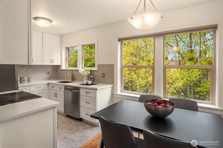 Top-floor corner unit looks out over Warren Ave N, a quiet tree-lined street.