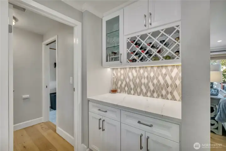 Bar, coffee, or beverage station with additional storage and built-in wine rack.