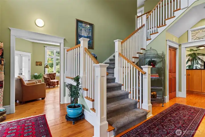 Entry way, front room to left and stairs up to 3 bedrooms.  Kitchen entry to right.