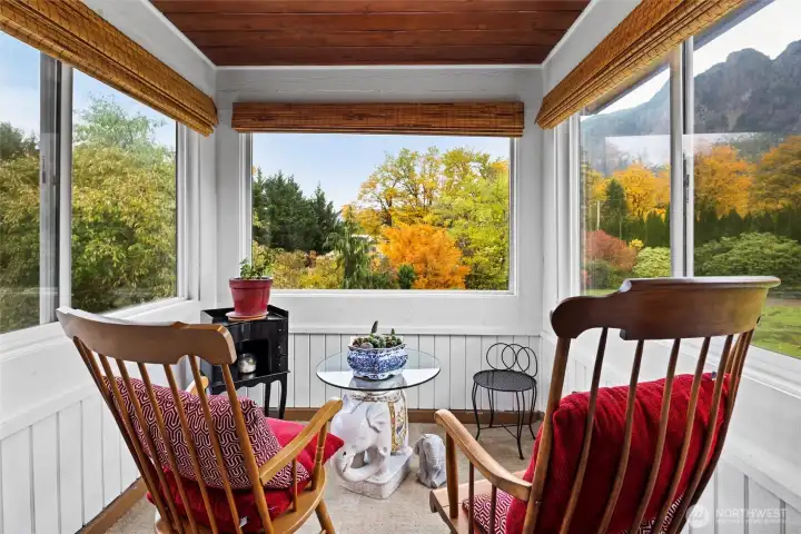 Covered sitting area off primary bedroom.  Having a coffee or your favorite beverage while just taking in the surroundings.