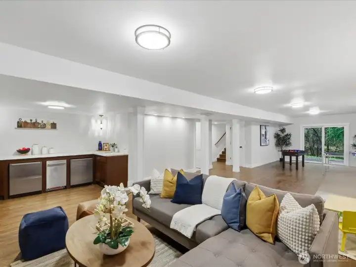 Light and bright, and complete with wet bar with sink, dishwasher, and 2 refridgerators!